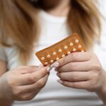 Young slim woman enjoys weight loss result